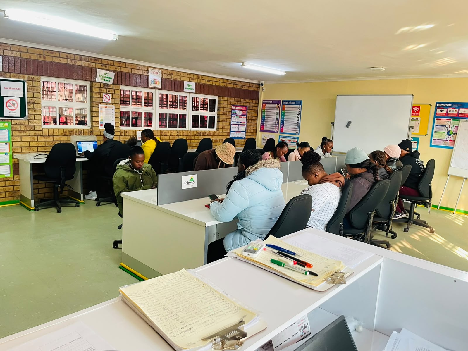 Learners completing practical ICDL activities in the AIT training centre