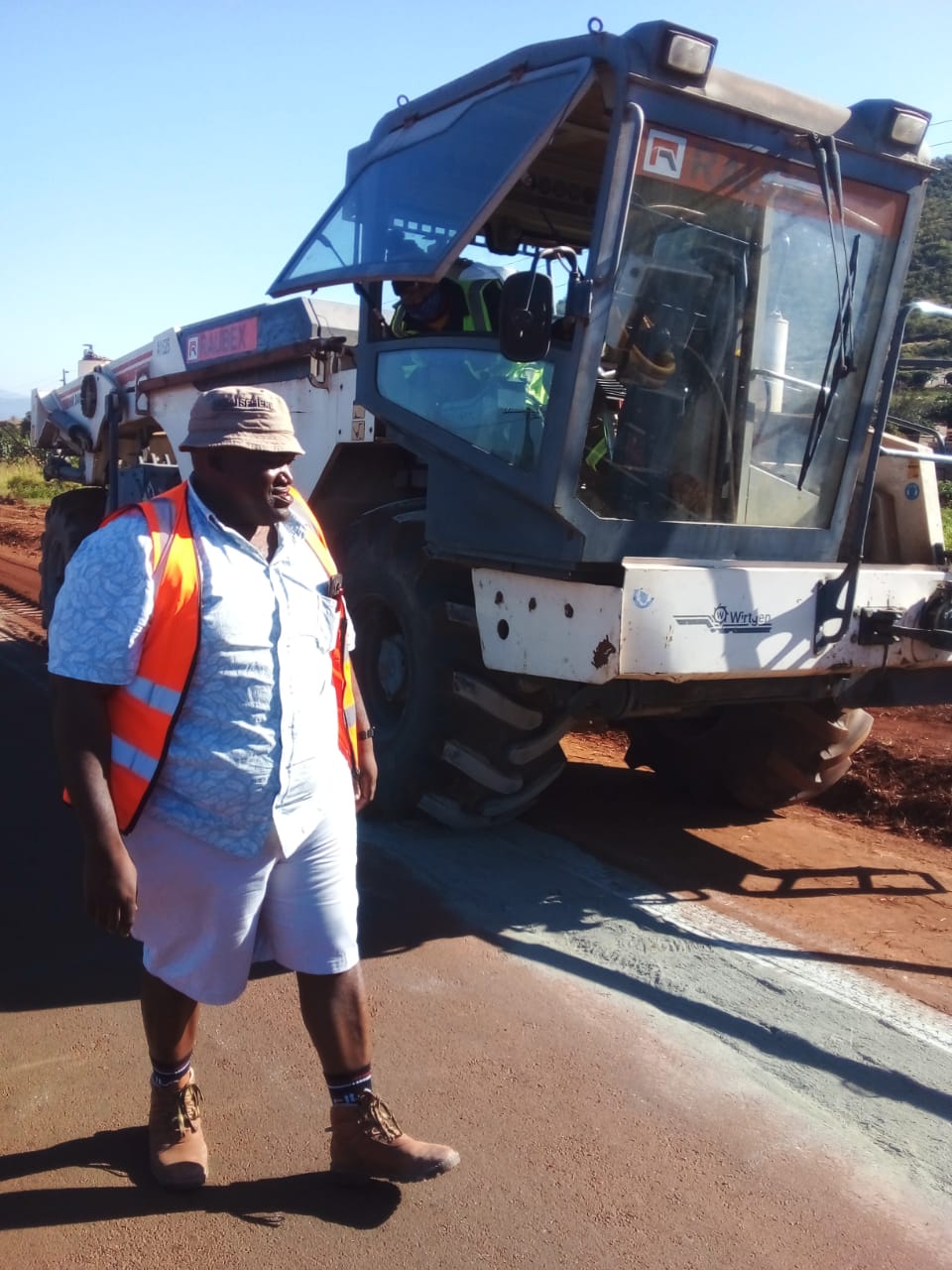 Site supervision beside road construction machinery during the R36 project in Tzaneen